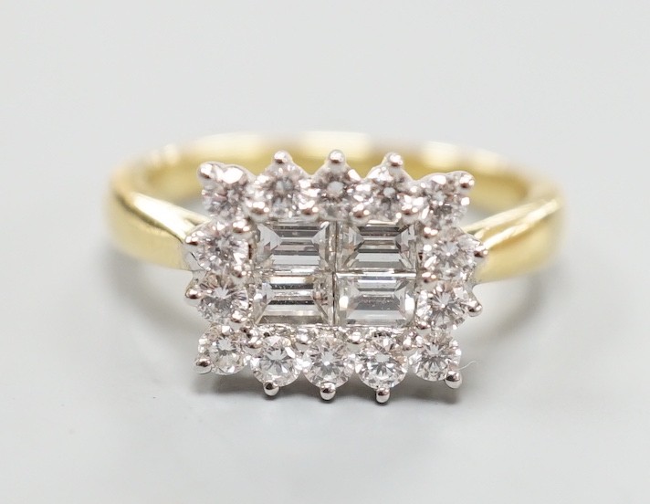 A 750 yellow metal, baguette and round cut diamond set rectangular cluster ring, size M, gross weight 4.8 grams.